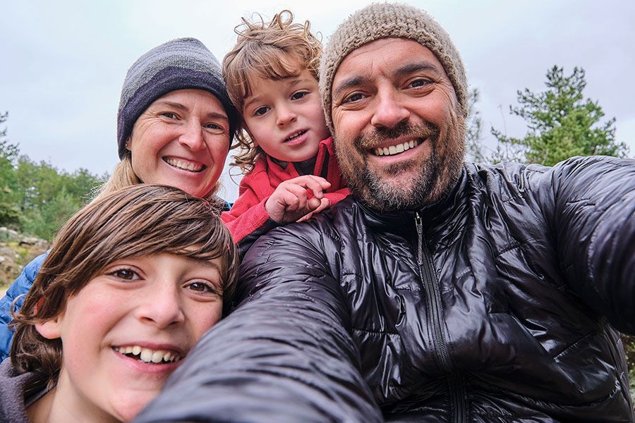 A happy family taking a selfie outside