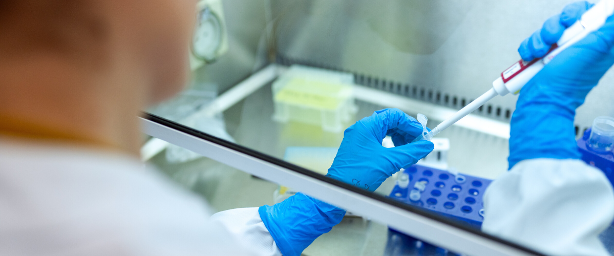 a scientist tests a sample in a lab