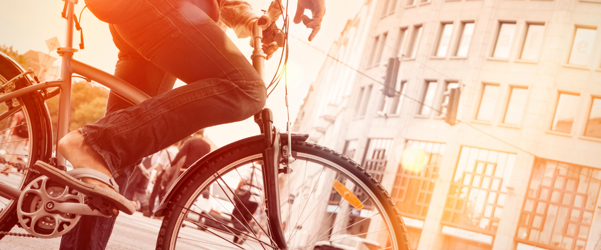 A person biking in an urban area