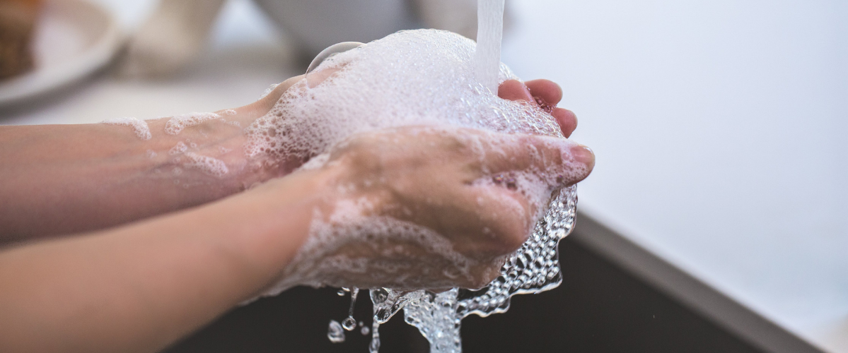 Hands being washed with soap