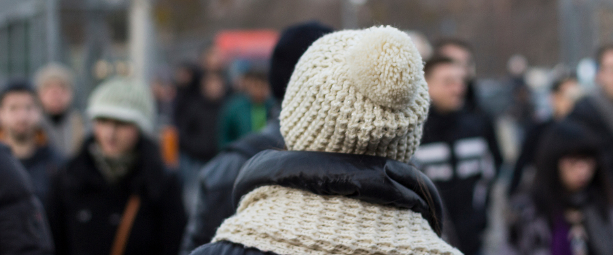 a person wearing a toque outside in a crowd of people